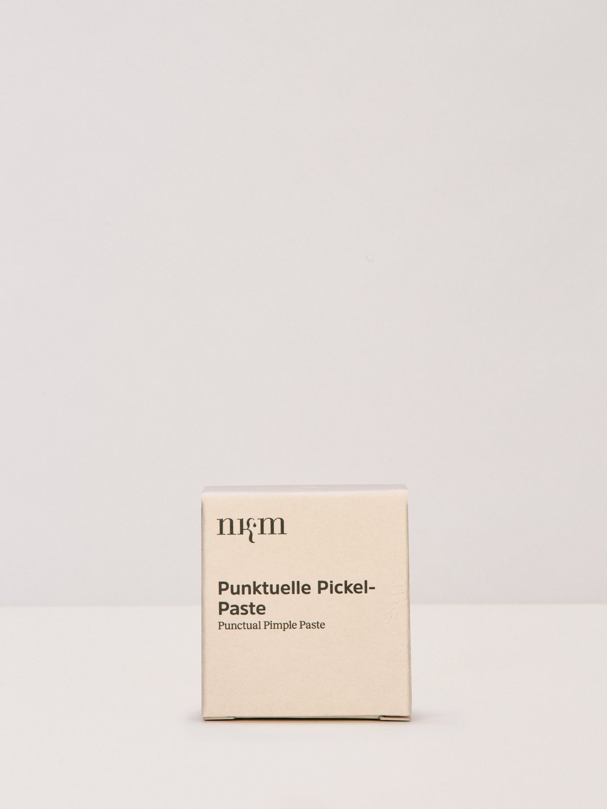 Punktuelle Pickel Paste in Faltschachtel