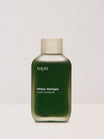 Eine grüne Flasche nkm Naturkosmetik München GmbH Milder Reiniger Gentle Cleansing Oil mit Brokkolisamenöl und einer beigen Kappe, ideal für unreine Haut, dargestellt auf weißem Hintergrund.