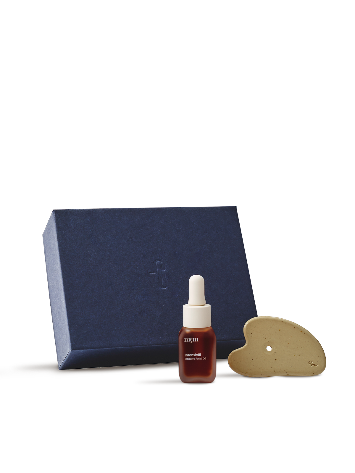 Blaue nkm Box mit Intensivöl und Gua Sha davor, vor transparentem Hintergrund